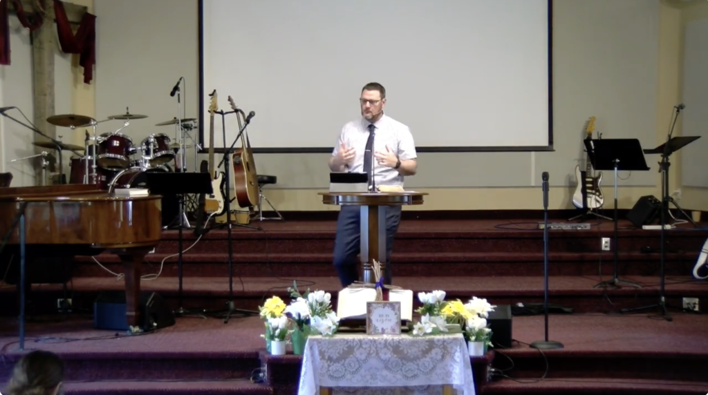 Rev Martin Chipp-Smith stand behind the pulpit